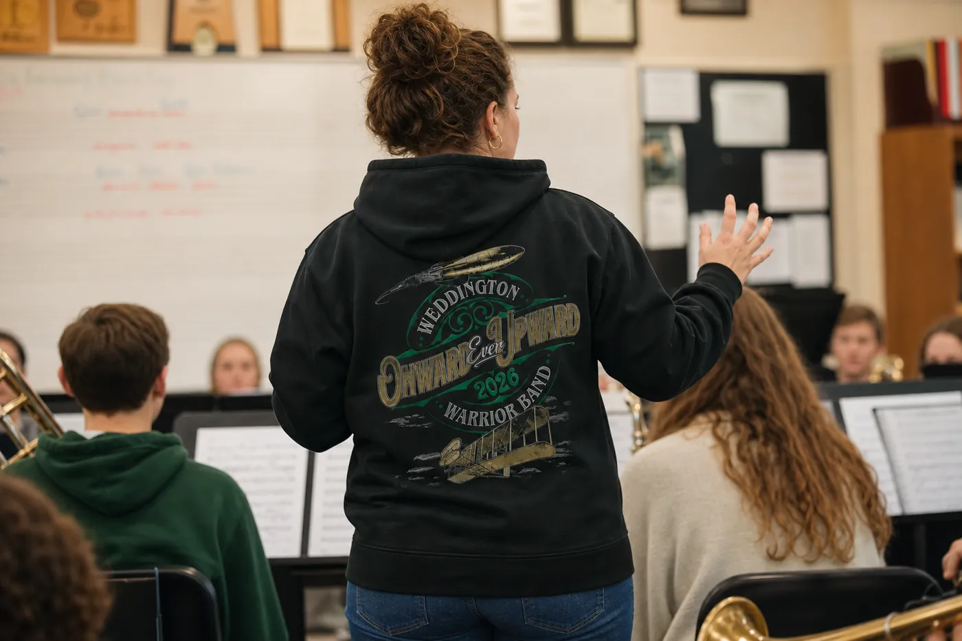 Band director in a Weddington Warrior Band 'Onward Ever Upward' hoodie printed by Excel Sportswear